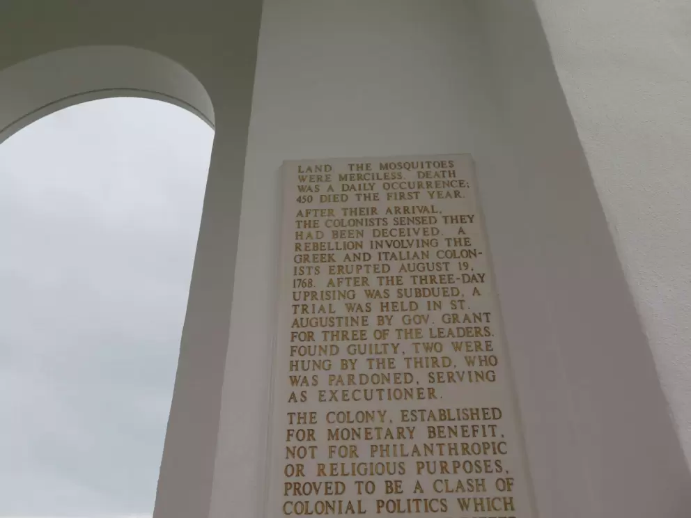 The AHEPA Odyssey Memorial, a white pavilion describes how "the mosquitoes were merciless."