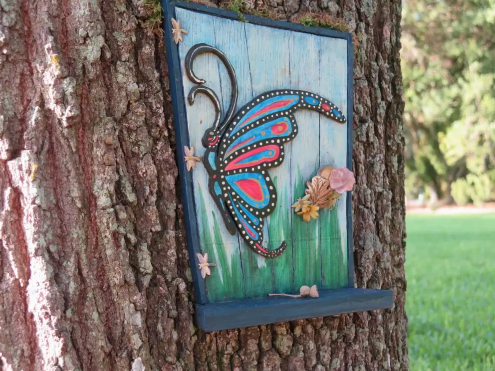 Butterly fairy door with lovely blues and greens.