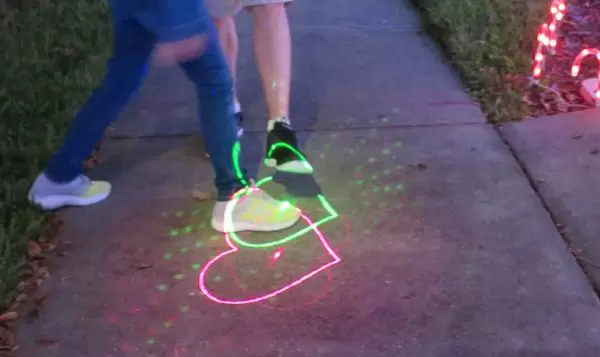 Laser hearts on the sidewalk.