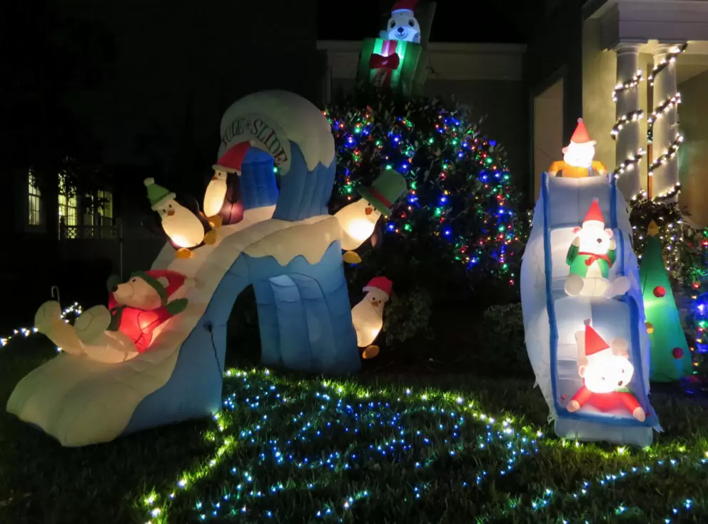 Adorable Christmas display with penguins on slides, at a house on Campus Street.