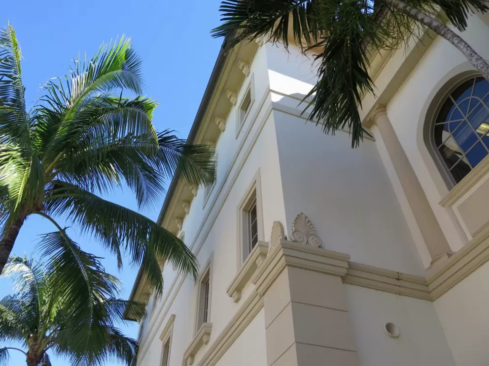 Curlicue and leaf design on a building.