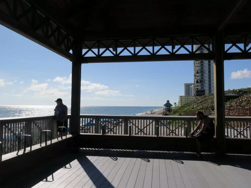 Highrises and lifeguard shack in the distance, as seen from the pavilion.