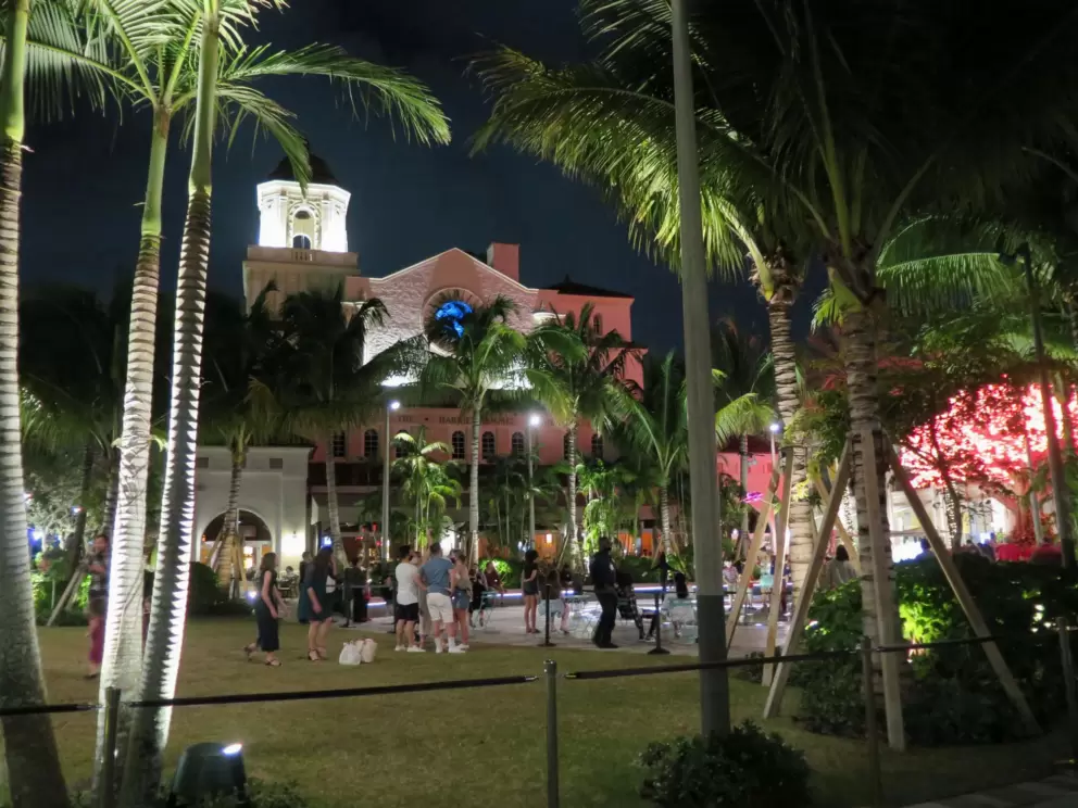The square with people gathered around the fountain.
