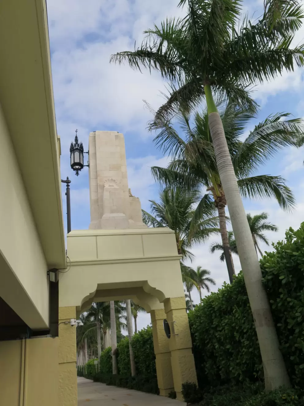 Greenest palm trees and gothic arches attached to the bridge.