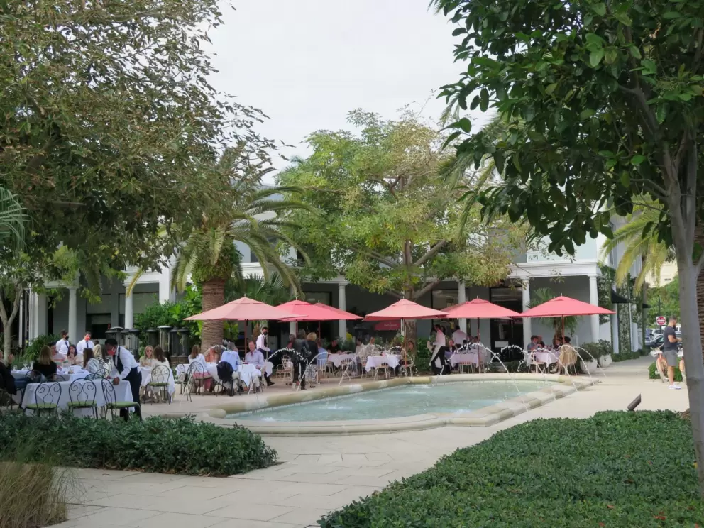 Sant Ambroeus, with its colorful umbrellas by the fountains.