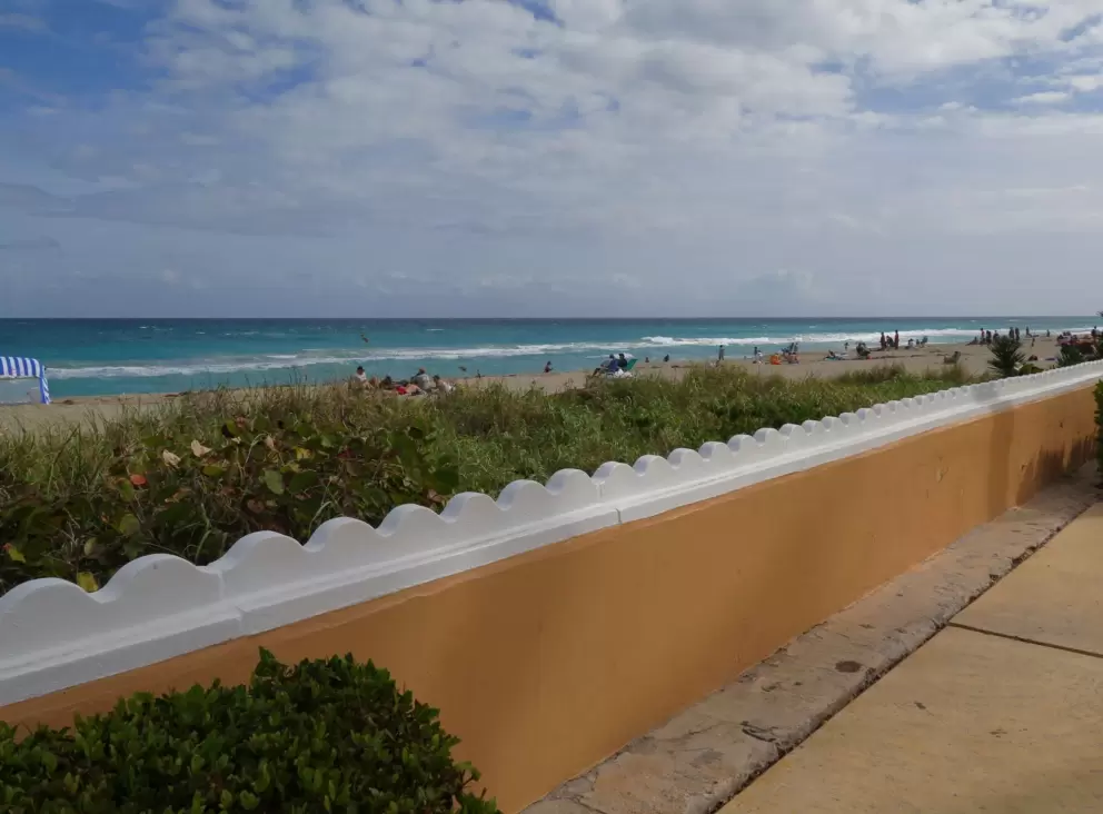 Wave wall and sidewalk beside it. 