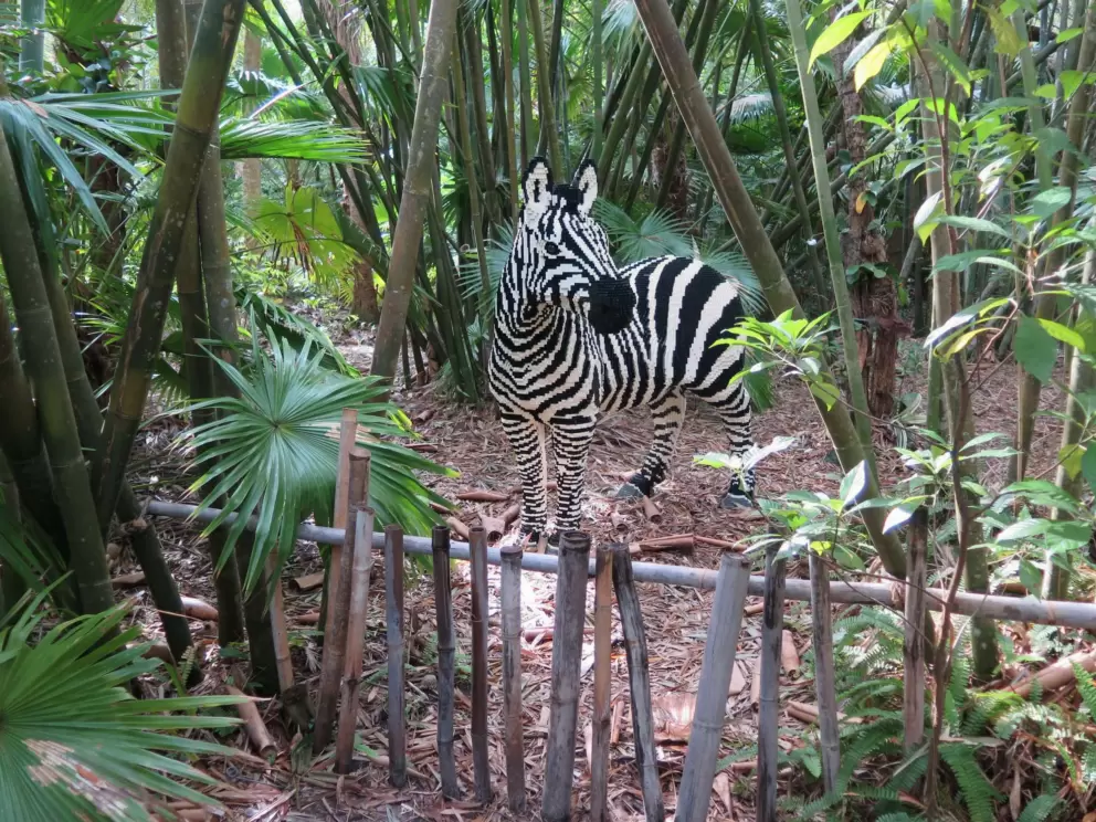 Zebra lego sculpture, among bamboo.