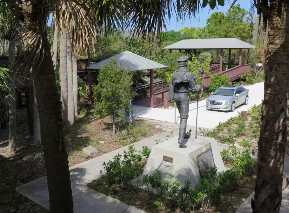 Looking down at the mailman sculpture.