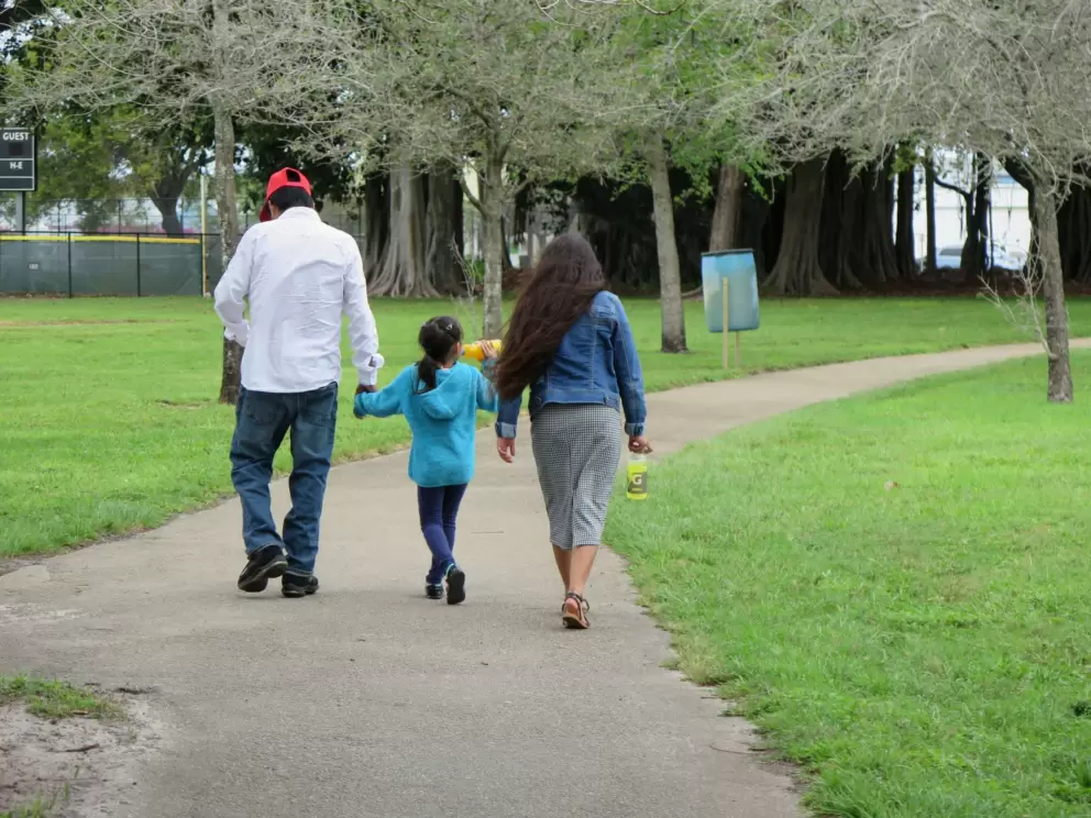 A family walking the path.