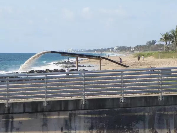 Sand dredging operation at the beach.