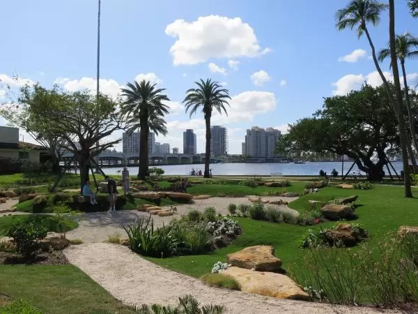 The recessed area with boulders and flower beds.