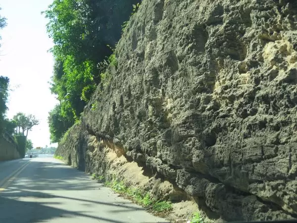 Witch's Wall, a coral cut segment of road at 300 Country Club Rd, a side street with no sidewalk off the North Lake Trail. 