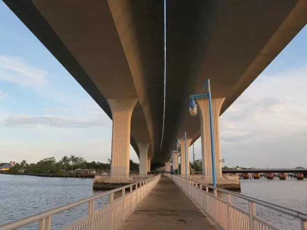 The walkway under the bridge.