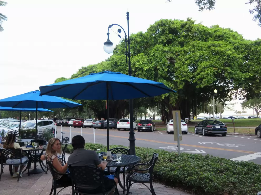 Dining with a view of the banyan trees along Beach Drive.
