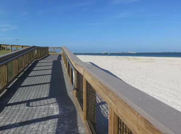 Wooden boardwalk that leads down to the beach.