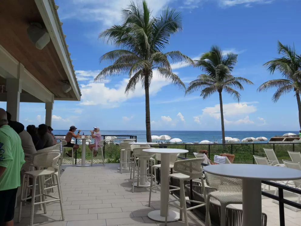 Sitting at the bar with views of the ocean.