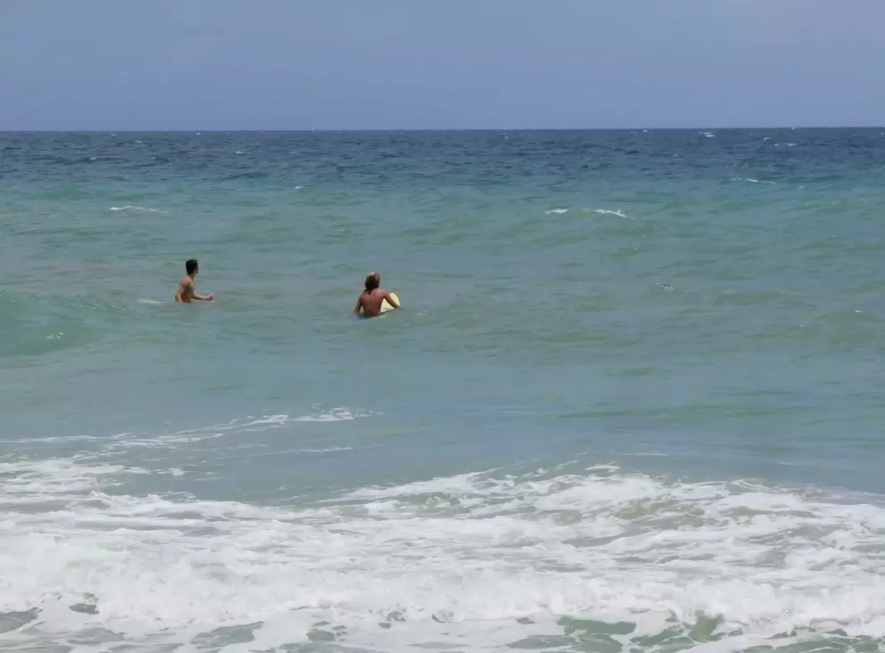 Surfers enjoying the water.