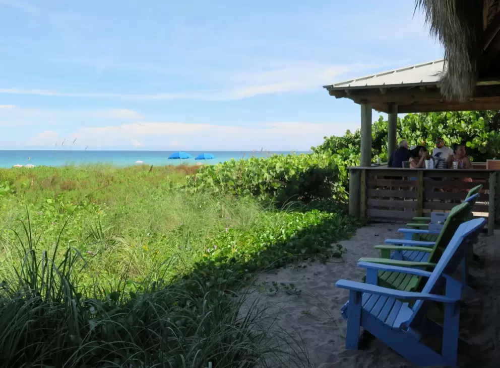 The beautiful beach concession shack and adirondack chairs.