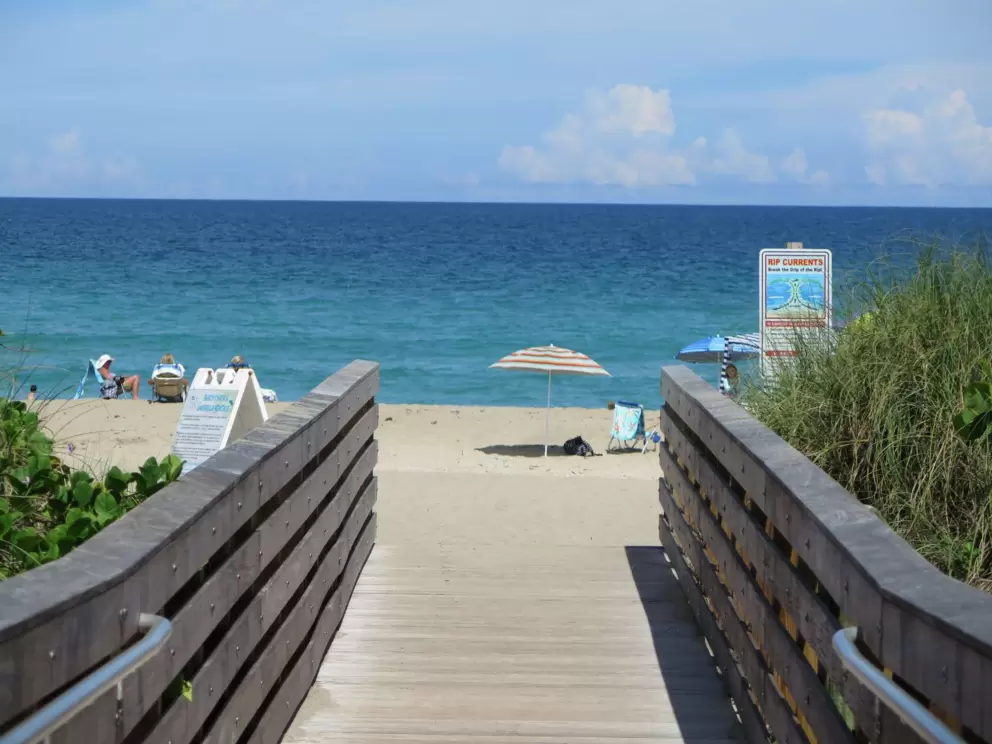 View as you enter the beach! Striped umbrella!
