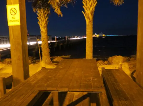 Picnic table at the base of the pier.