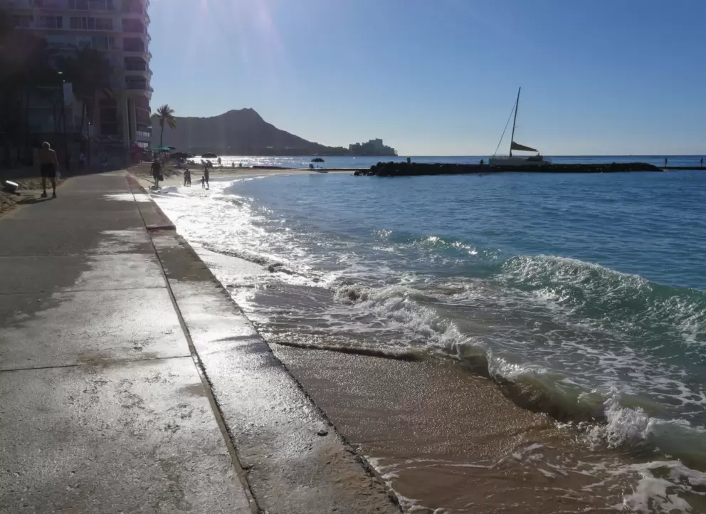 Sidewalk right at the water's edge on the east end of Fort DeRussy Beach. 
