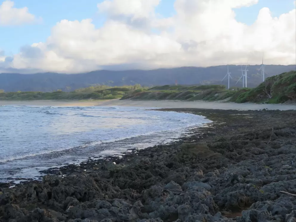 Lava rock, and windmills in the distance.