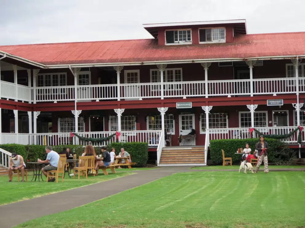 Parker Square has a beautiful reddish-brown building with white banisters.