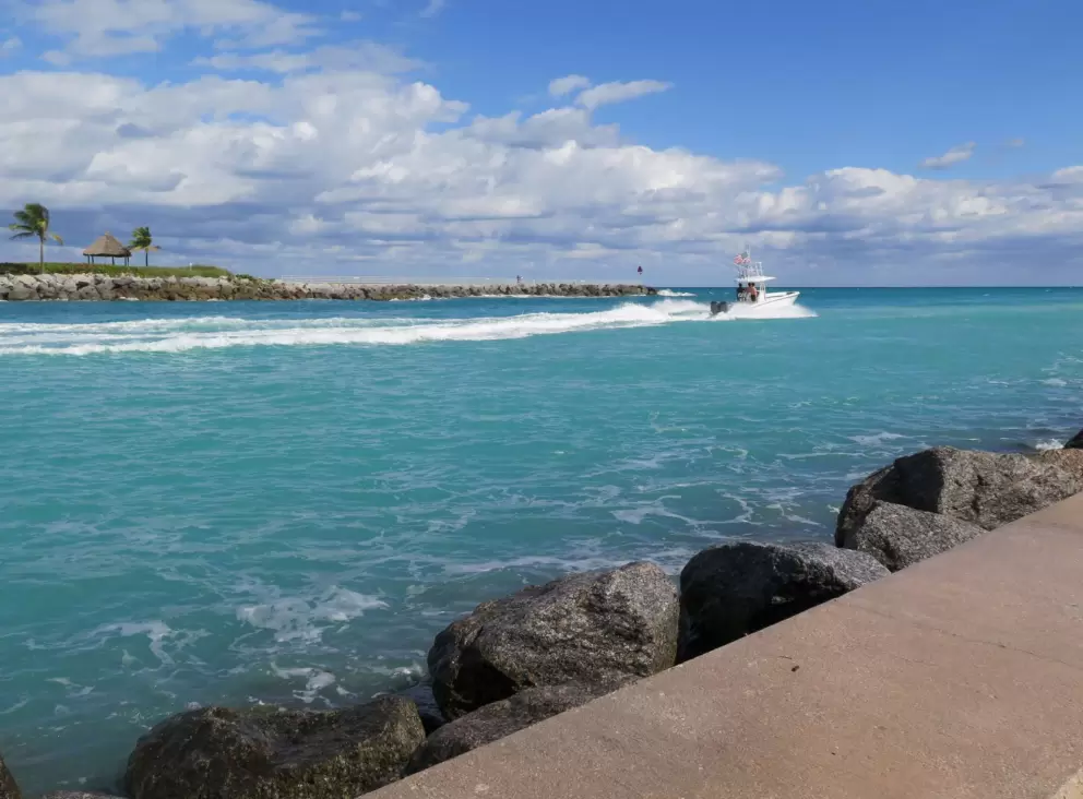Fishing boat heading out the inlet.