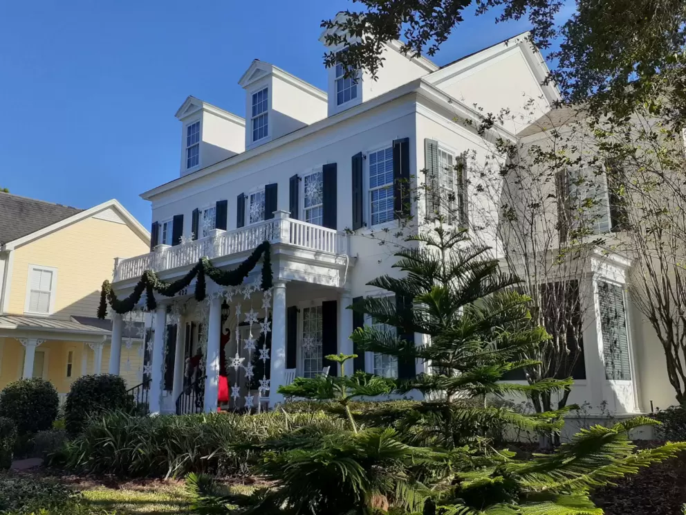 Colonial-style home decorated for Christmas.