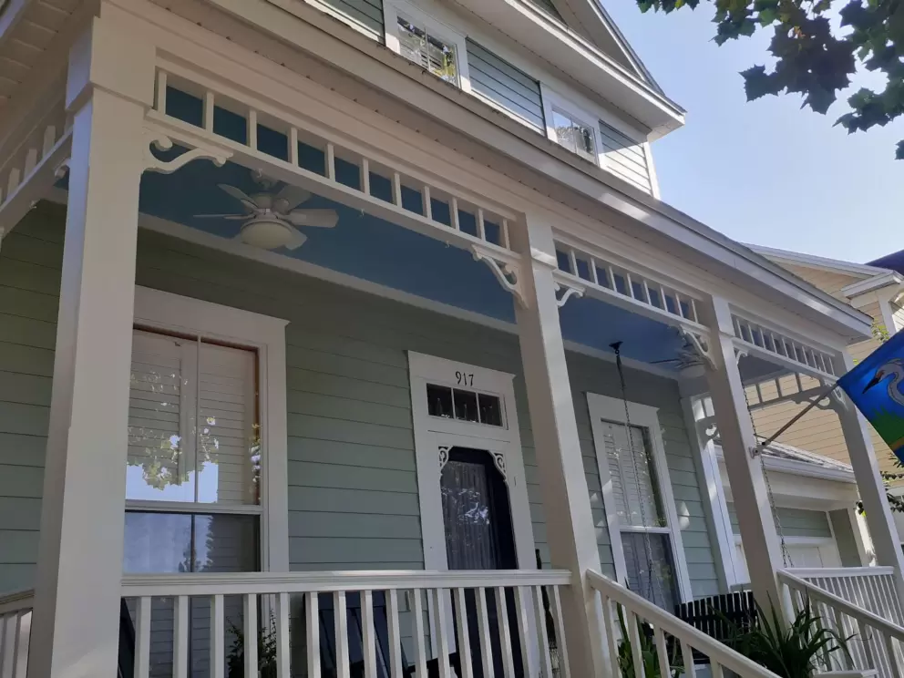 I like how the ceiling of this front patio is painted blue!