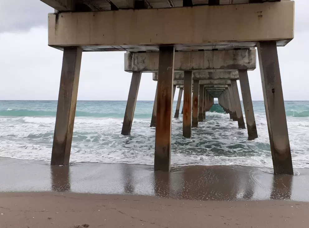 It's lovely to stand under the pier and watch the waves roll in.
