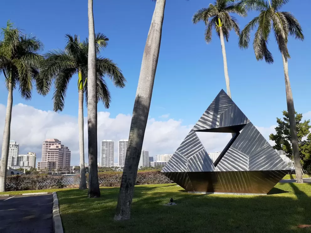 Pyramid sculpture lit up in the sun.