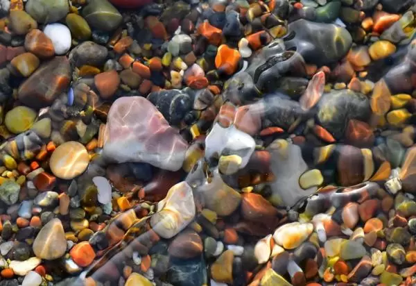 Colored rocks in the water at Moonstone Beach.