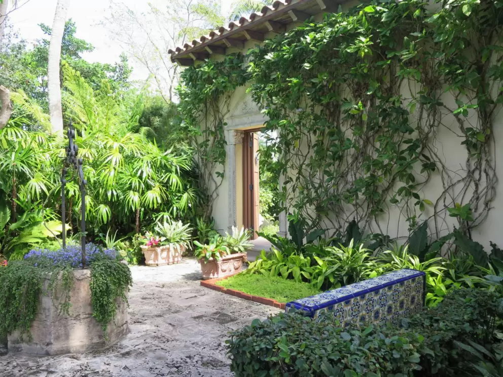 Blue tile courtyard with door to other section of the gardens.