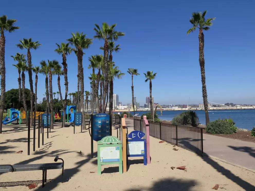 Playground with exercise stations beside the path.