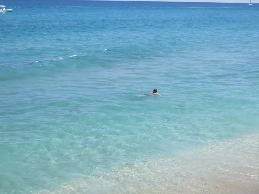 A boy has a lazy swim.