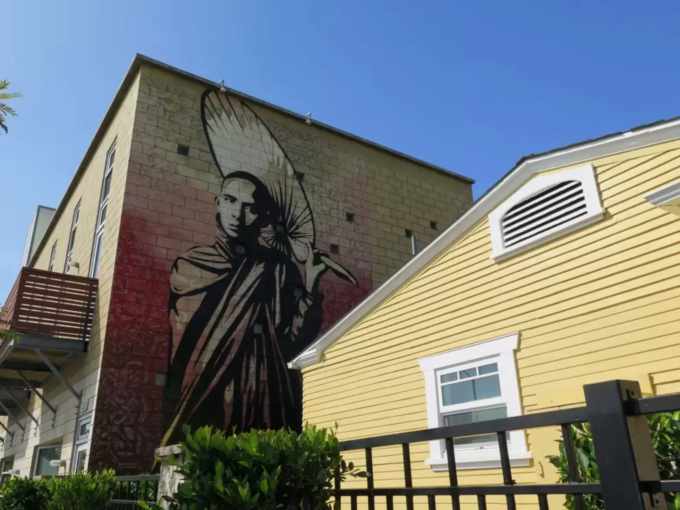 Mural and yellow building.