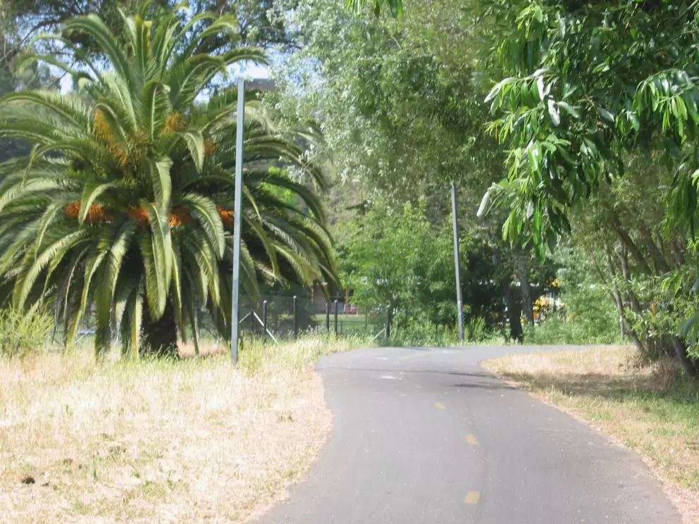 The path winds around, near Nogal Dr. 