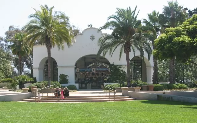 The beautiful carousel with its huge windows looking out on the trees.