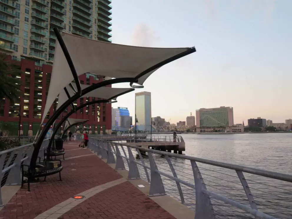 Colorful pavers, sails above you, glistening buildings, and the water. 