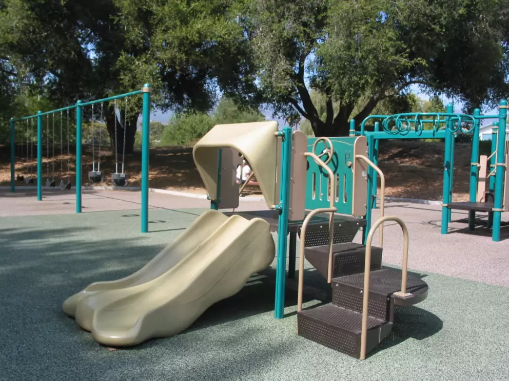Play structure and swings.