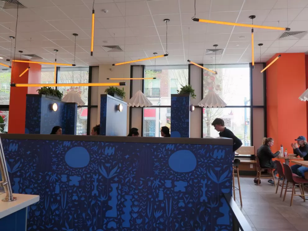 Roots Natural Kitchen has delicious bowls, colorful decor, and lots of students. 