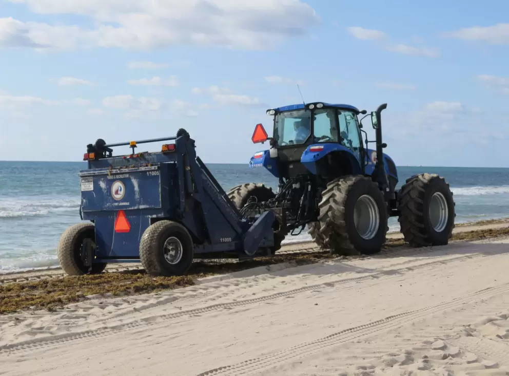 Tractor that scoops up the copious amounts of seaweed.