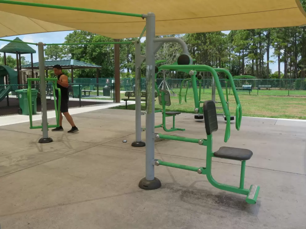 Lift your weight in the shade under the canopy.