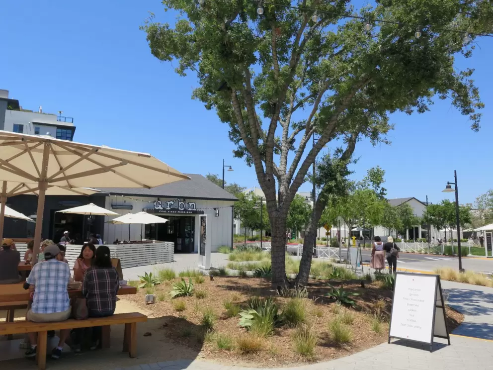 Sitting outside on a sunny day at One Paseo. 