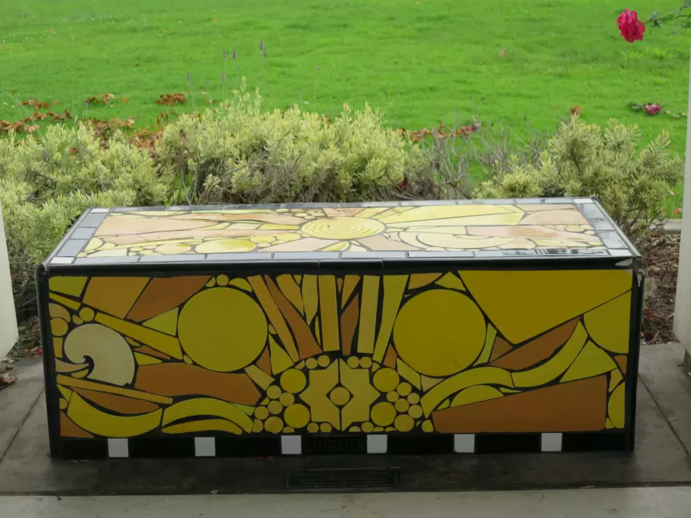 Mosaic yellow and orange bench.