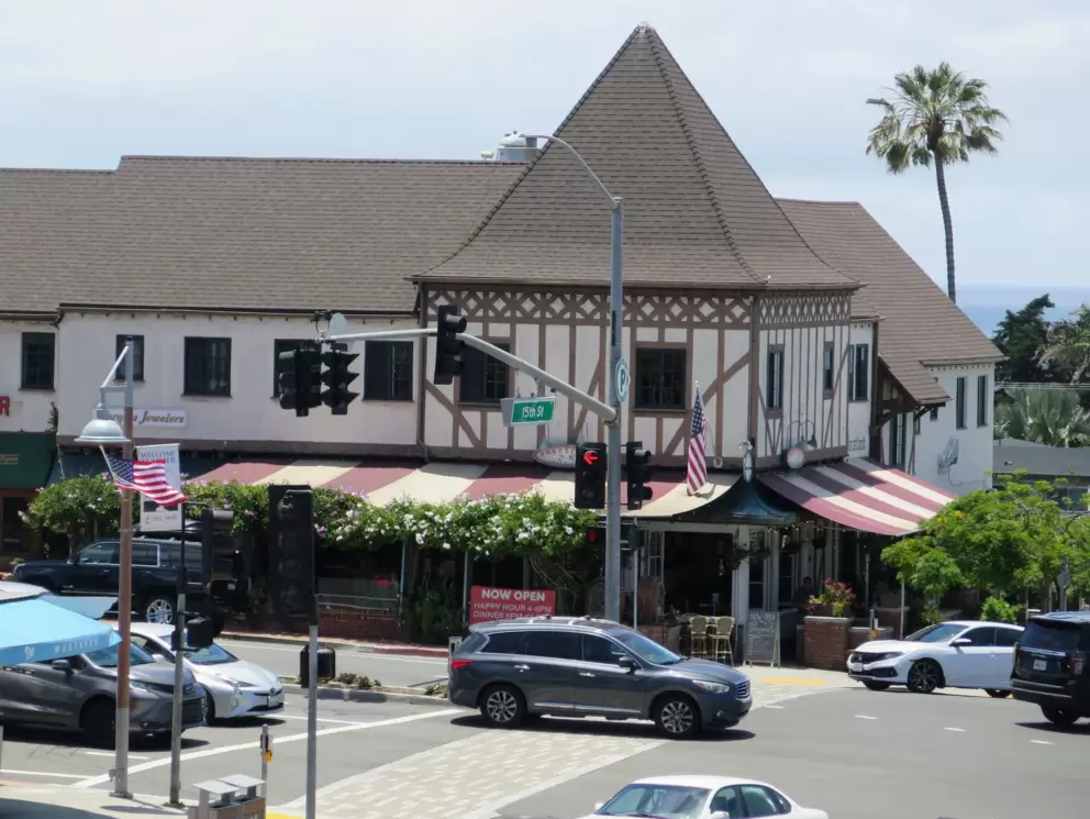 Half-timbered building below.
