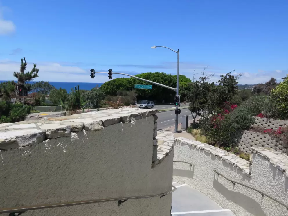 Staircase down to the road, with views of the sea.