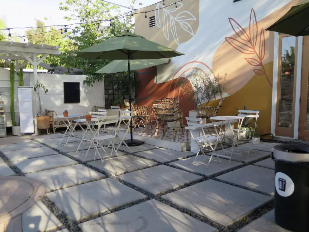 A cafe's courtyard with a lovely mural.