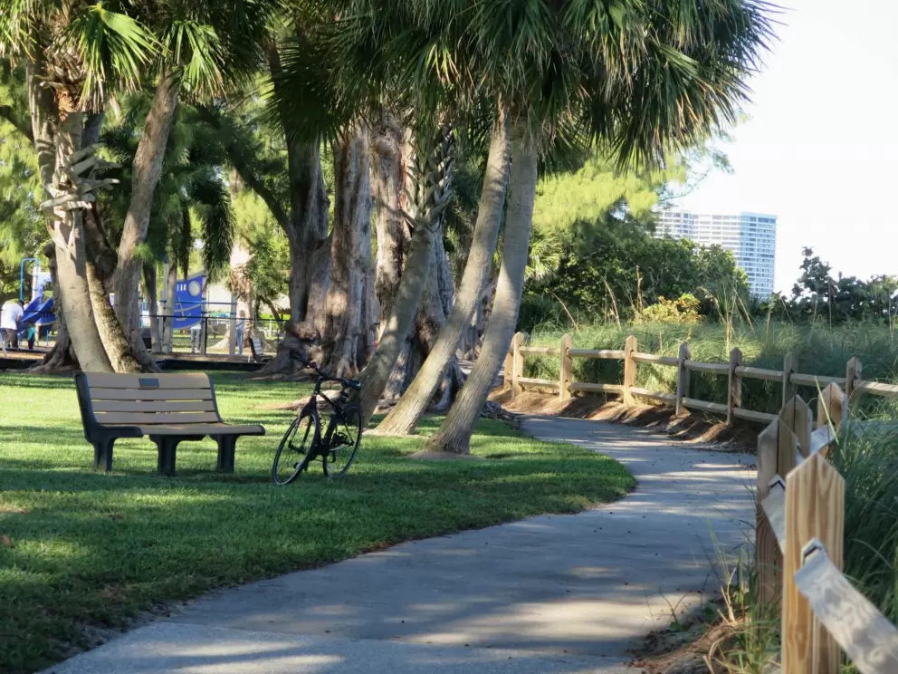 Winding, shady path by the water.